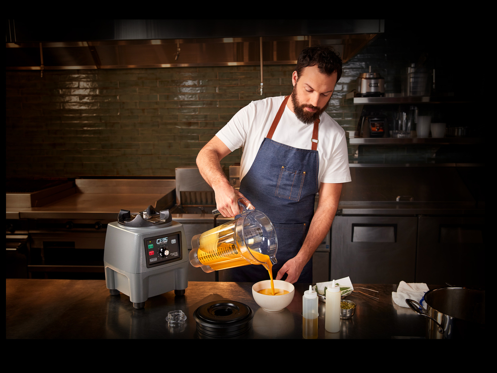 Chef pouring liquid from blender | Waring